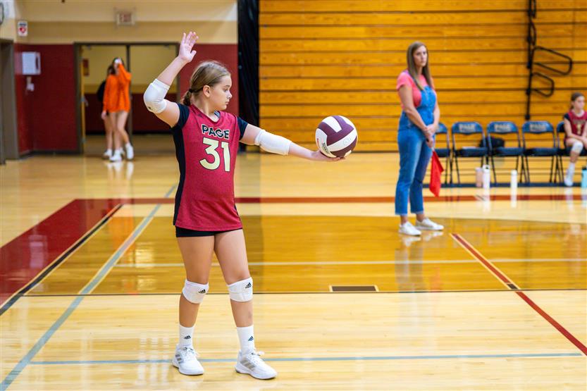 Student-athletes play volleyball